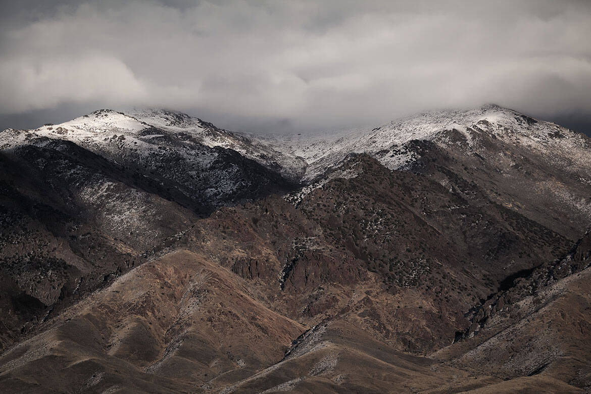 Snow-covered summits under heavy cloud in the mountains of northern Japan