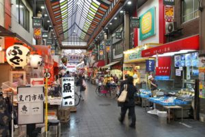 Shoppers visit Nipponbashi Kuromon market in Osaka, Japan