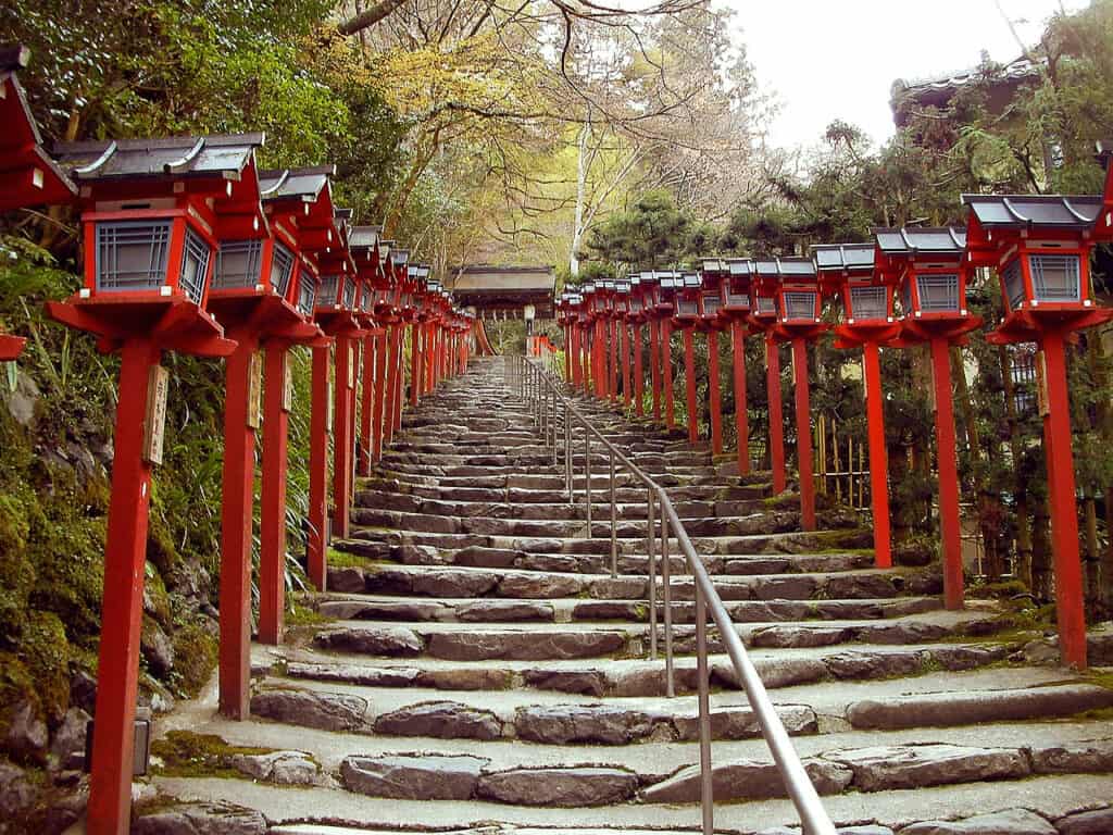 Hidden temples in Kyoto: red lanterns line the stone steps up Mount Kurama toward Kurama-dera