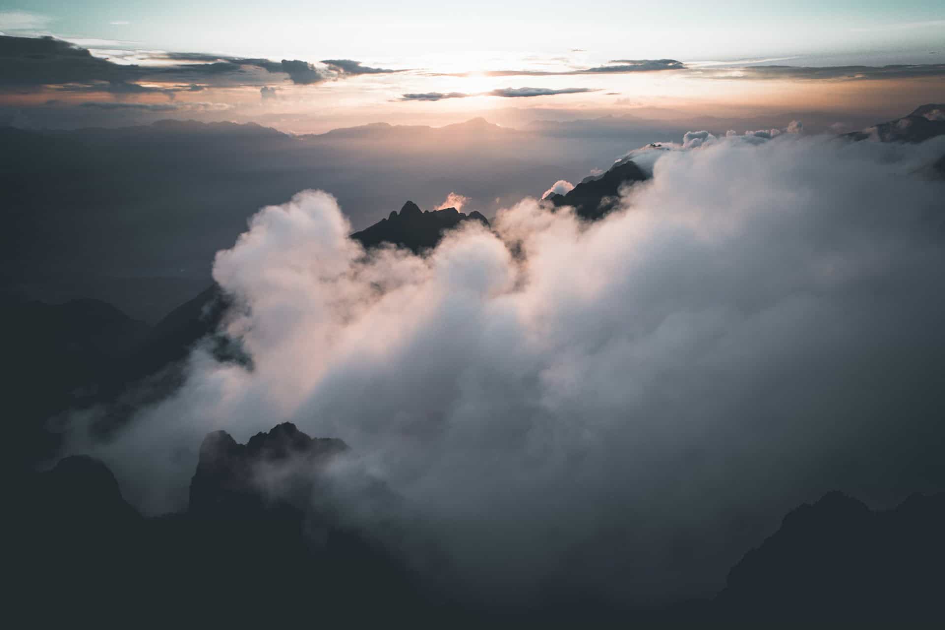Peaks rising through a sea of cloud at sunrise over the mountains of Japan