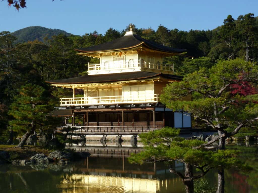 The Golden Pavilion of Kinkaku-ji reflected in its pond, one of Kyoto's busiest sights