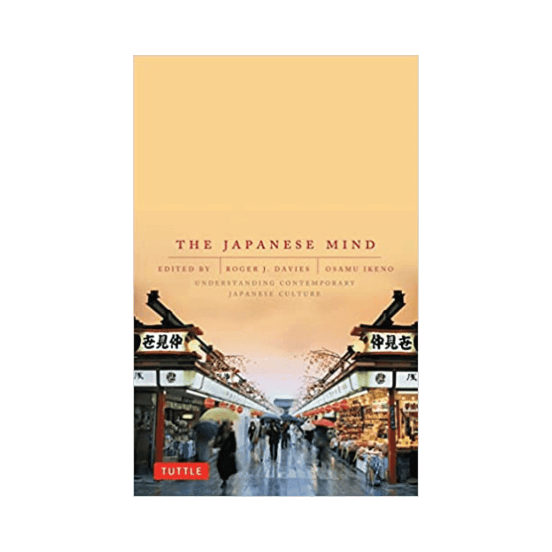 Cover of The Japanese Mind showing a lantern-lined shopping street in warm light