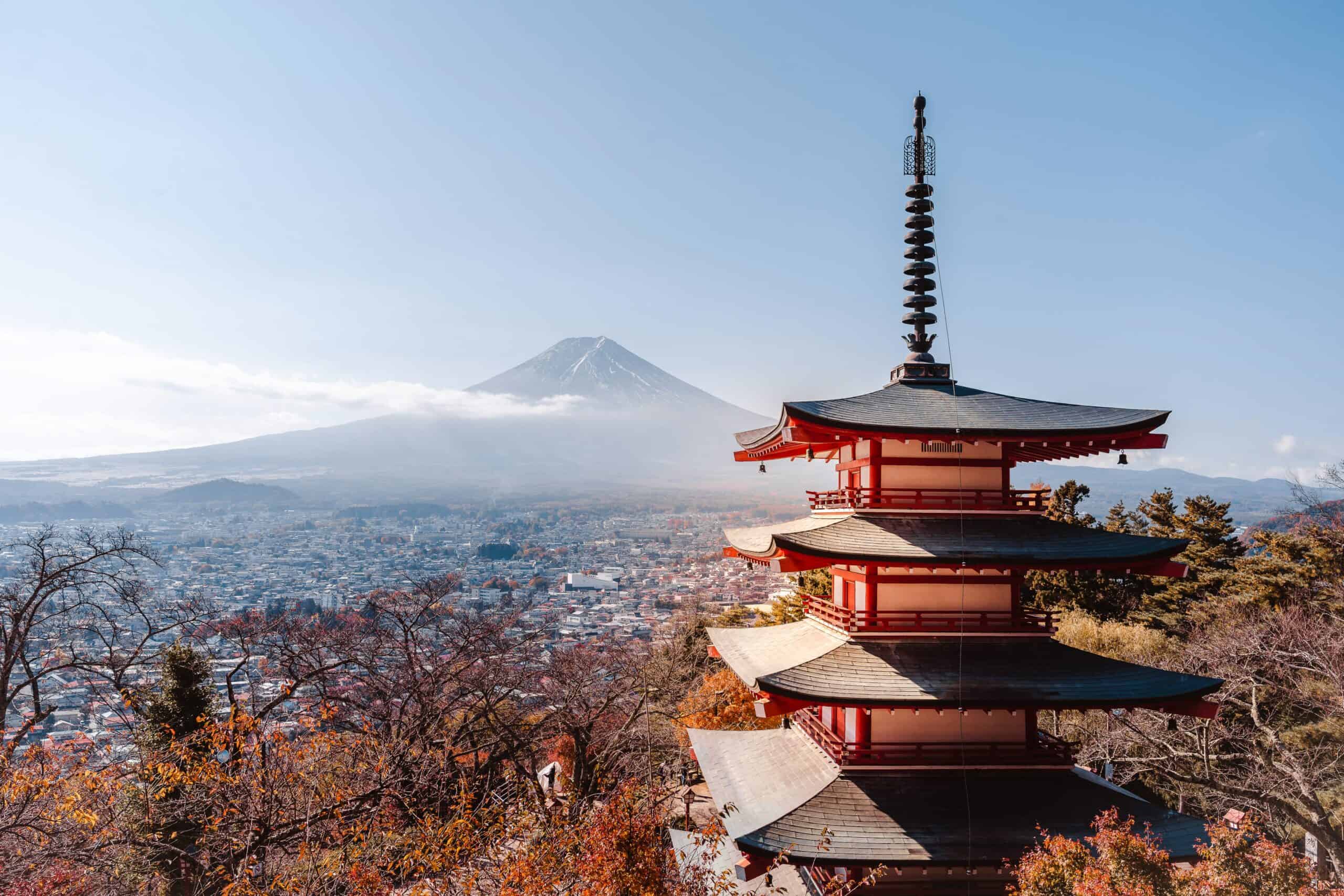 Mount Fuji and the Chureito Pagoda framed by red autumn foliage under a clear sky