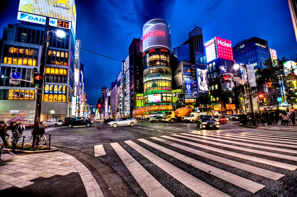 The psychology of travel in Japan after dark: illuminated shopfronts along a Ginza avenue in Tokyo