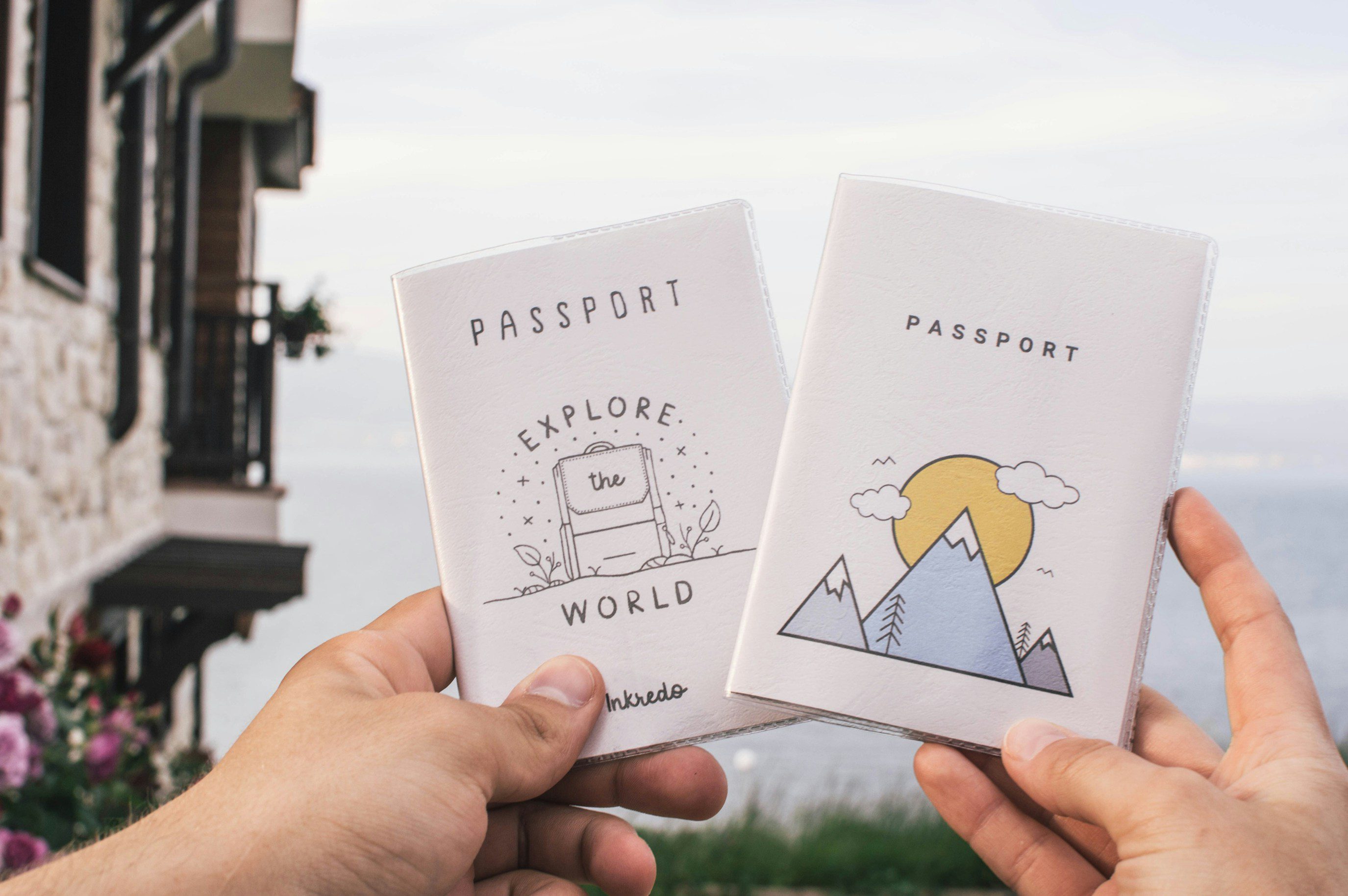 Travelers holding passport covers - Explore the World, Mountain