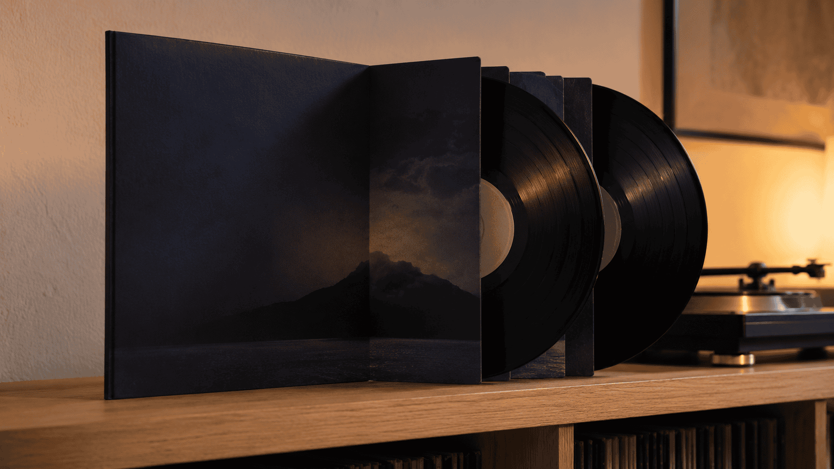 A gatefold double-LP Studio Ghibli soundtrack vinyl record beside a turntable