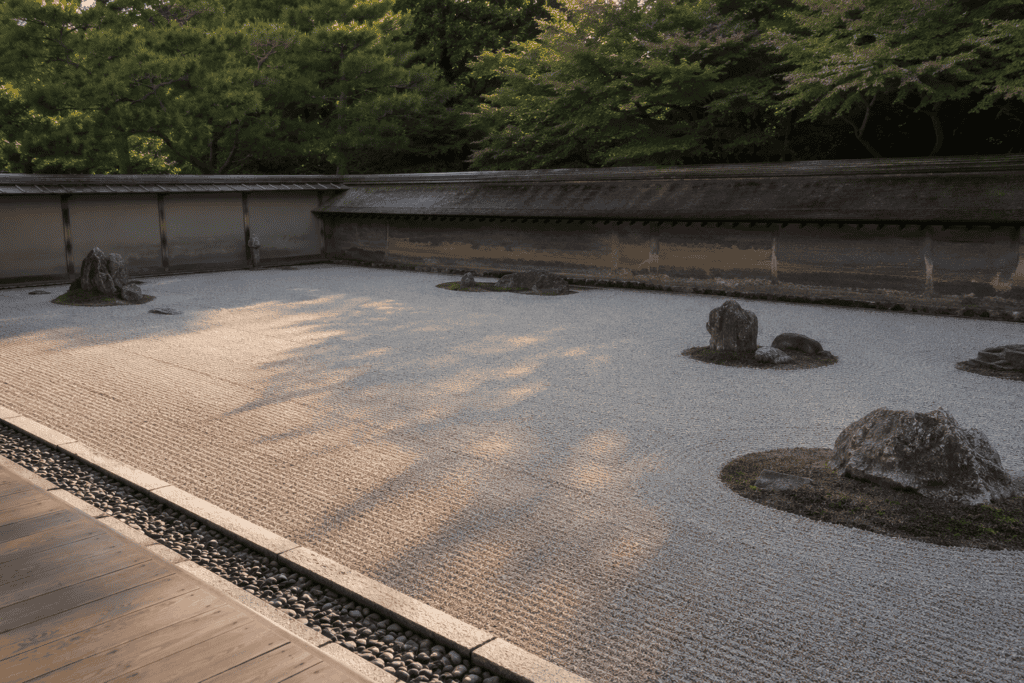 A dry garden in Kyoto where raked gravel surrounds a few placed stones, an example of ma in Japanese design principles