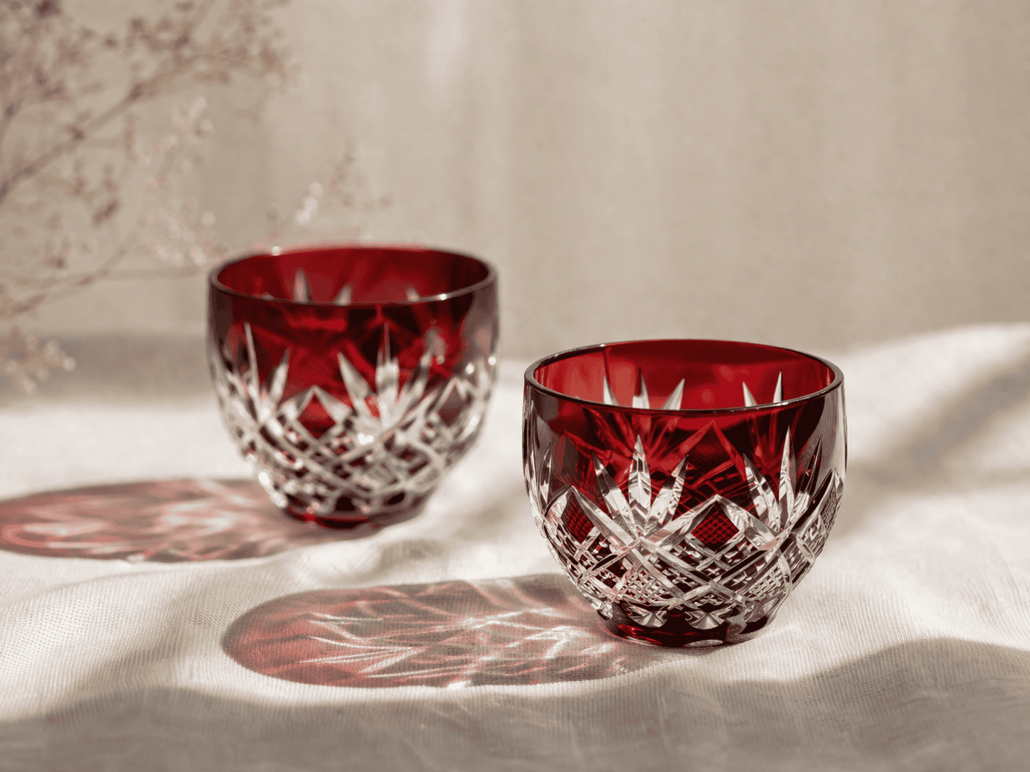 Kagami Crystal Edo Kiriko cut glass sake cups with light refracting through facets
