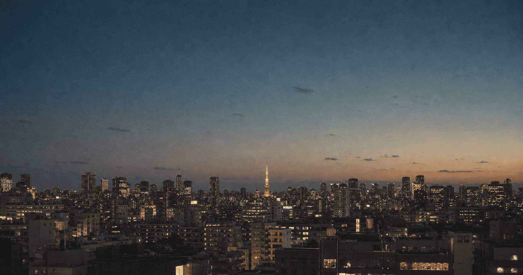 Tokyo skyline at blue hour — building toward life in Japan through the right residency pathway
