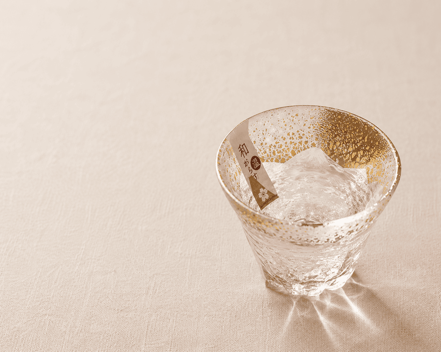 Anime gifts for the home: a gold-flecked Japanese glass on cream linen