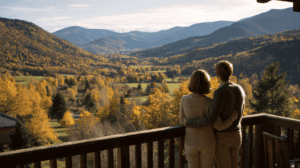 Couple enjoying a panoramic view of autumn mountains in Japan.