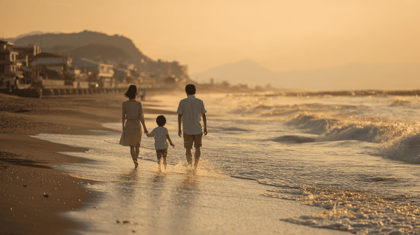 Family walking on a Shonan beach at golden hour, sharing a moment worth remembering