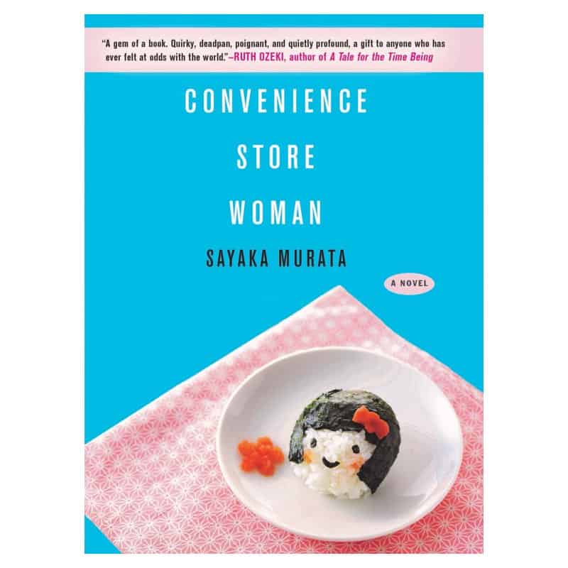 The cover of Convenience Store Woman showing a rice ball with a smiling face on a pink cloth