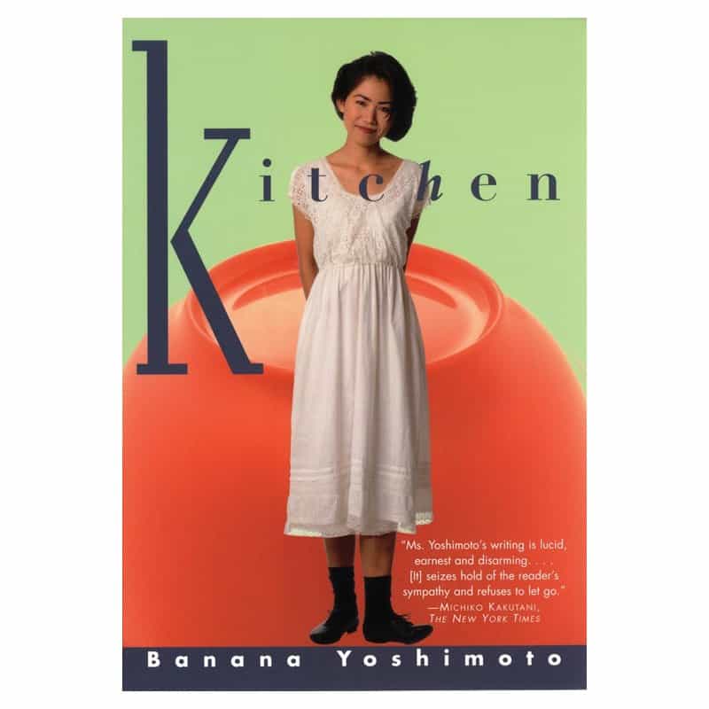 The cover of Kitchen by Banana Yoshimoto showing a woman standing in front of a large red shape