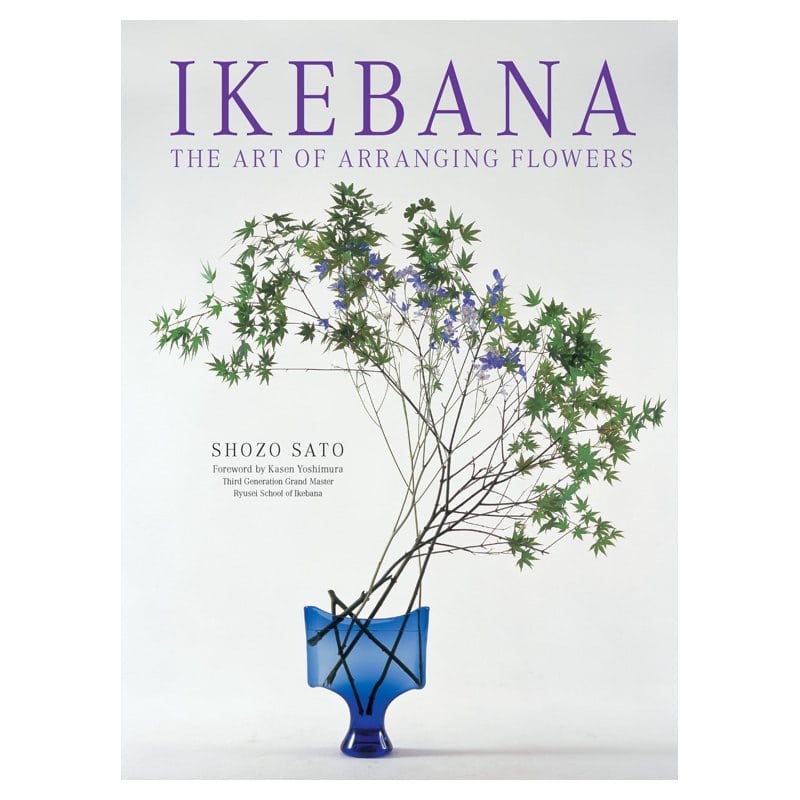 The cover of Ikebana: The Art of Arranging Flowers showing a branch arrangement in a blue vase