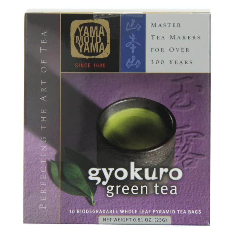 A purple box of Yamamotoyama gyokuro pyramid tea bags showing a cup of green tea
