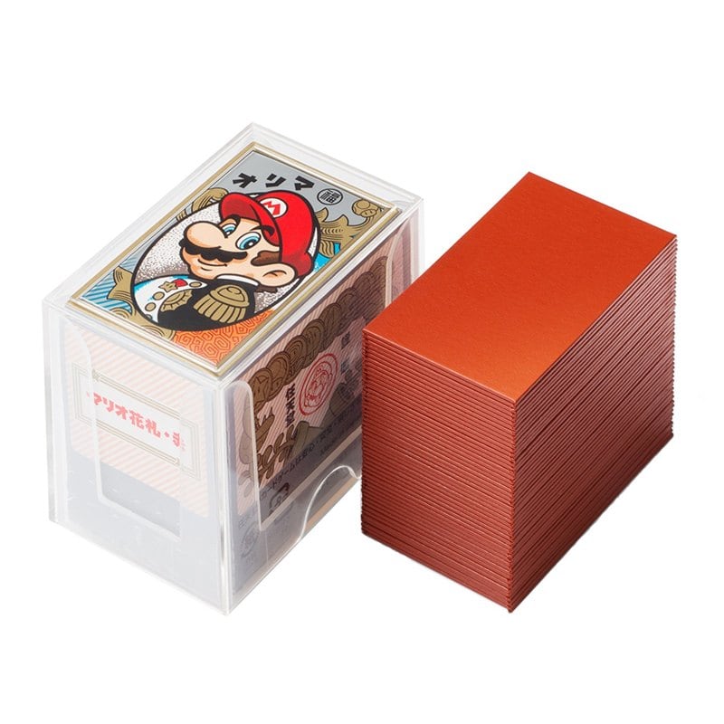 A red box of Nintendo Mario hanafuda cards showing Mario's face beside a stack of cards
