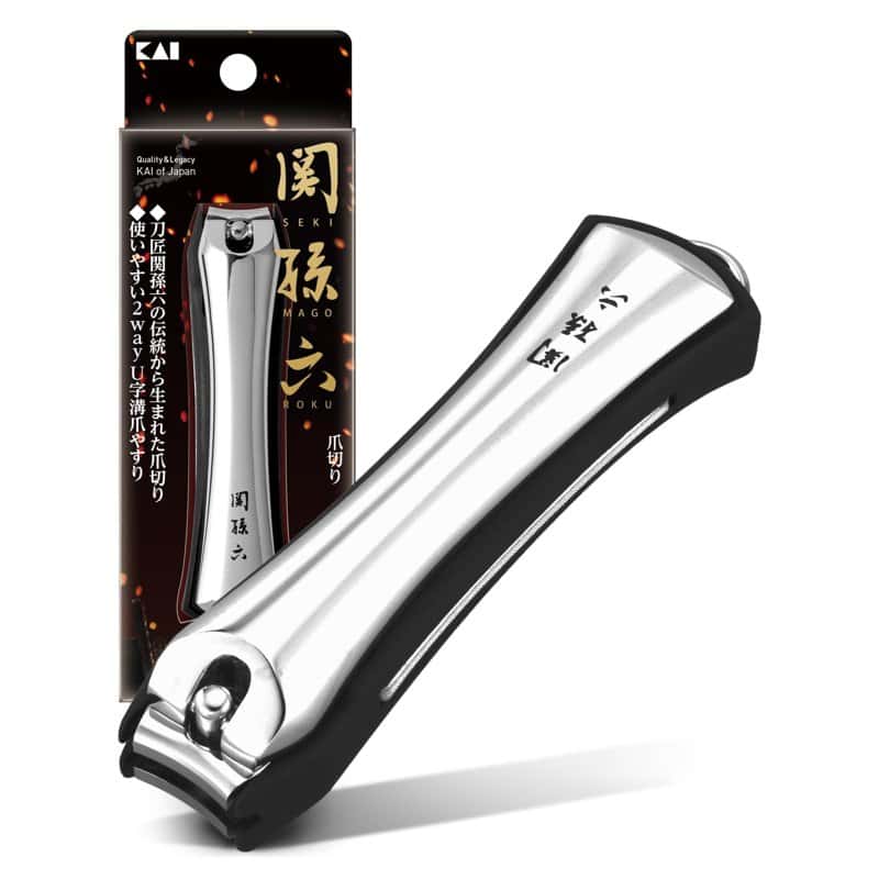 A stainless steel Seki Magoroku nail clipper beside its Kai packaging