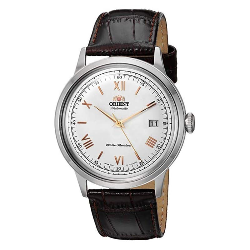 An Orient Bambino automatic watch with a domed white dial, roman numerals and a brown leather strap