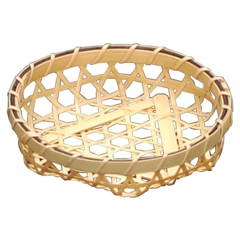 A small round white bamboo basket handmade in Japan