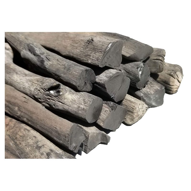 A pile of long, dense Kishu binchotan charcoal sticks with a silvery sheen