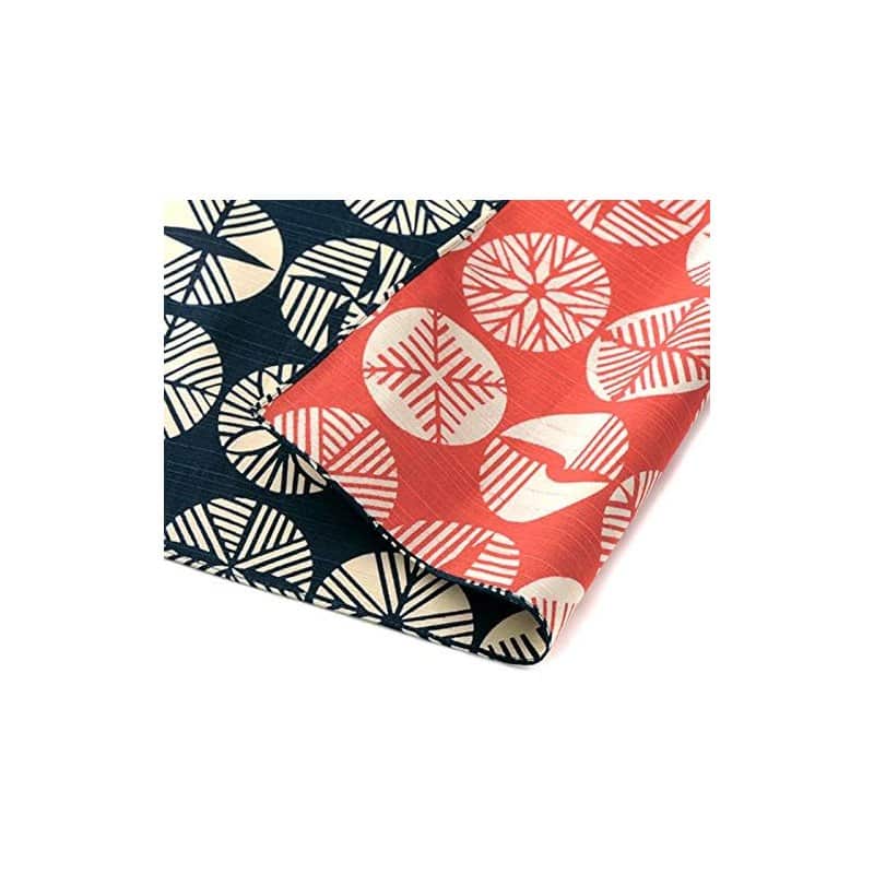 A large reversible cotton furoshiki in a red and black pine-leaf pattern, made in Japan