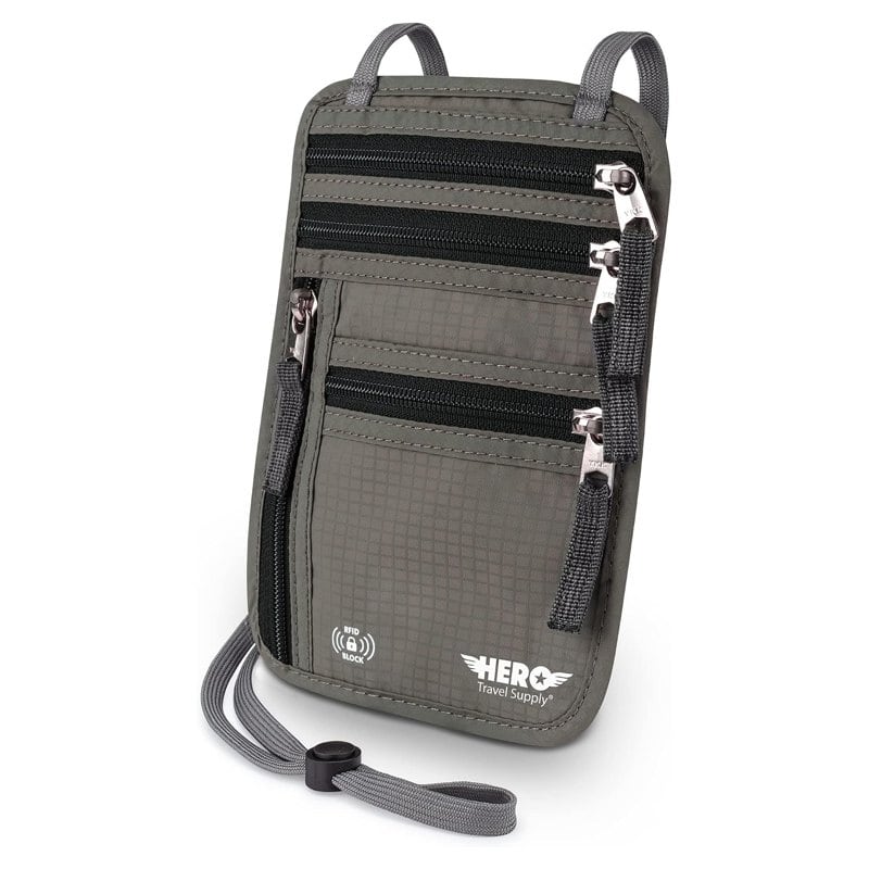 A gray HERO neck wallet with RFID blocking, holding a passport and cards
