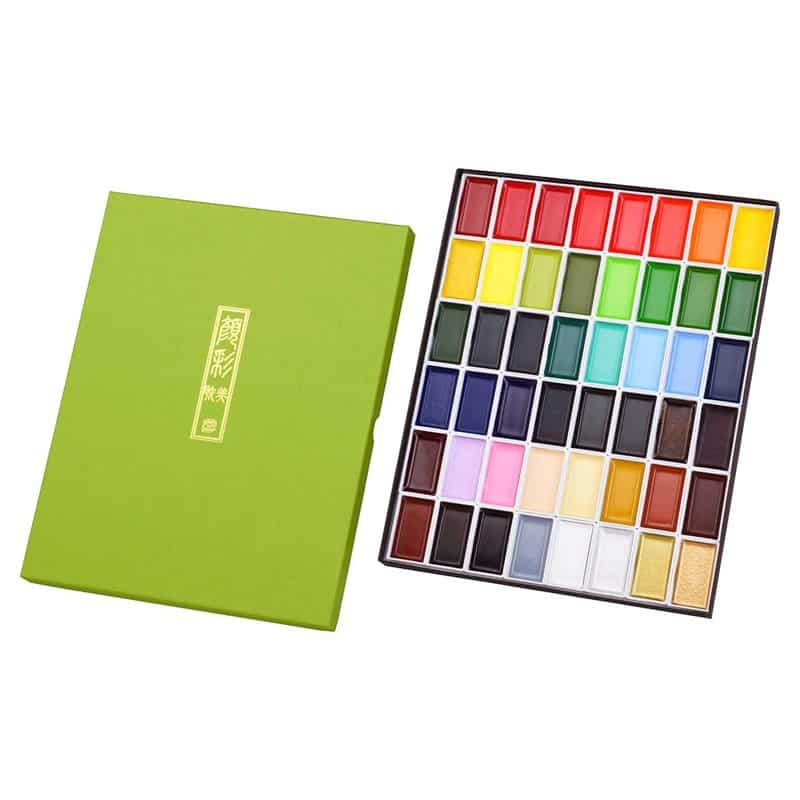 A Kuretake Gansai Tambi watercolor set with forty-eight colors in a green box