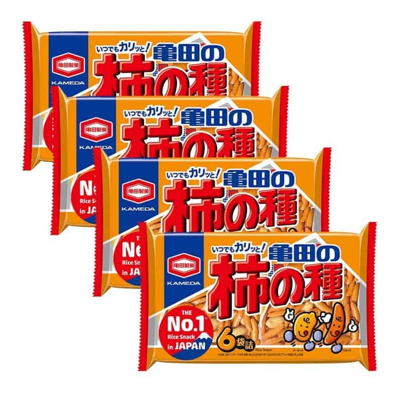 Four bags of Kameda Seika kakinotane rice crackers with peanuts in orange packaging