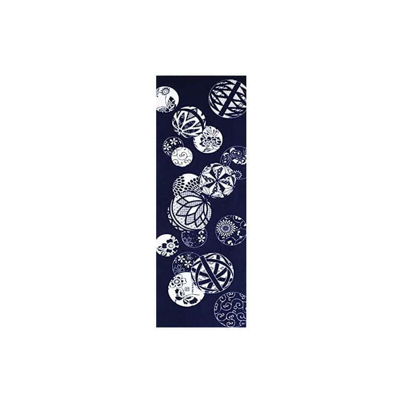 A navy Japanese tenugui hand towel with a small Ise katagami temari pattern