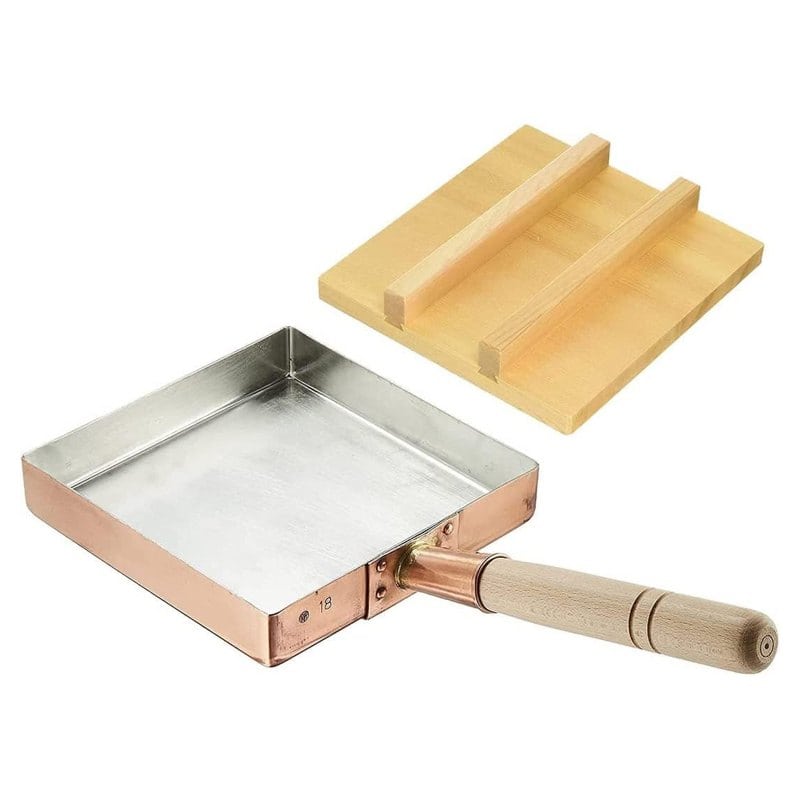 A square TIKUSAN copper tamagoyaki pan with a wooden handle and wooden lid, made in Japan