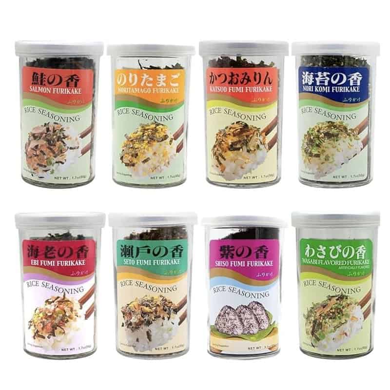 Eight jars of Japanese furikake rice seasoning in different flavors arranged in two rows
