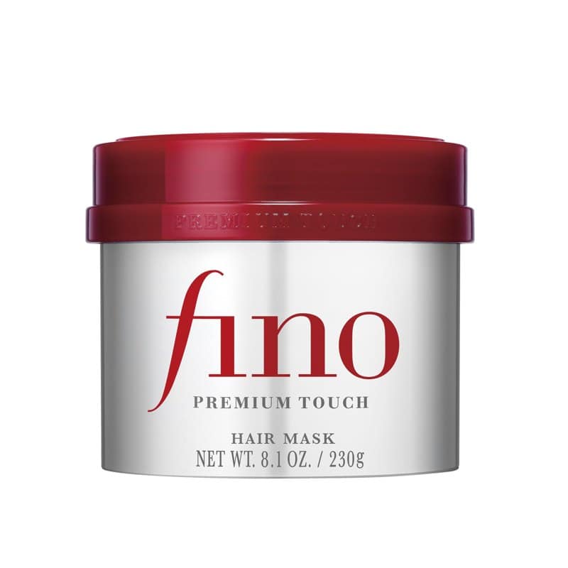 A silver and red tub of Fino Premium Touch hair mask on a white background