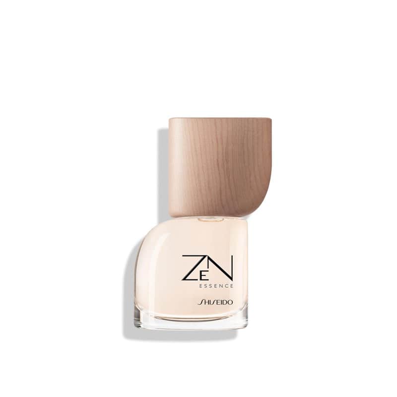 A pale Shiseido Zen Essence perfume bottle with a wooden cap